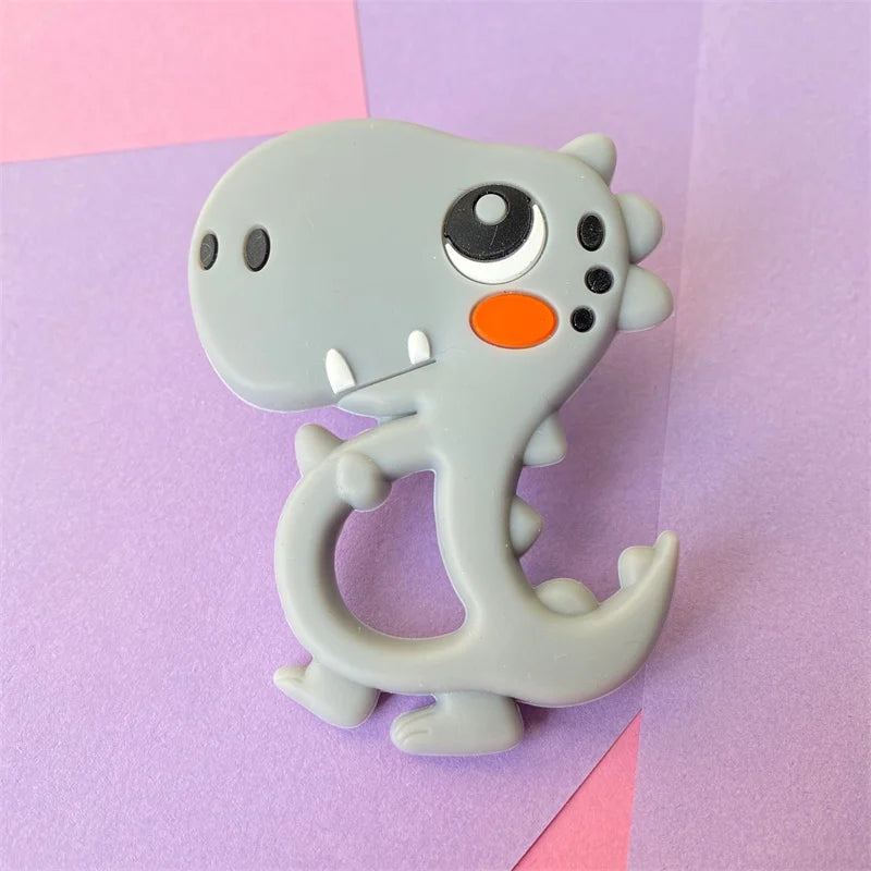 Grey dinosaur silicone baby teething toy for soothing sore gums.