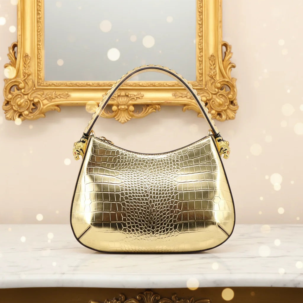 32cm gold metallic crocodile-embossed leather designer shoulder bag with decorative leopard head metal accents.