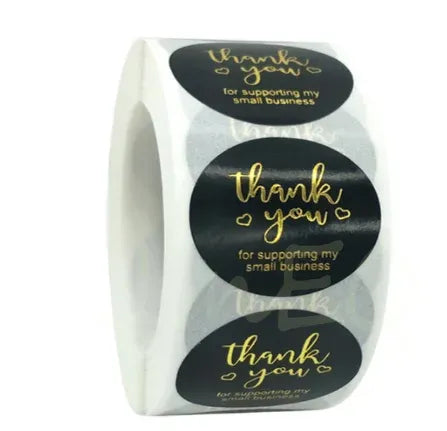 Heart thank you stickers on a roll, black hearts with gold “Thank You” and small-business text