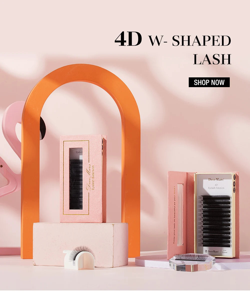 4D W-shaped black eyelash extension trays in pink boxes, displayed on stands with a minimalist, stylish aesthetic.