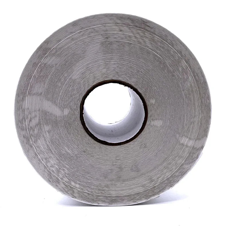 Close-up of gray thermal label paper reel roll with center core hole