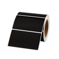 Black thermal label roll with two blank rectangular labels on a dispensing reel