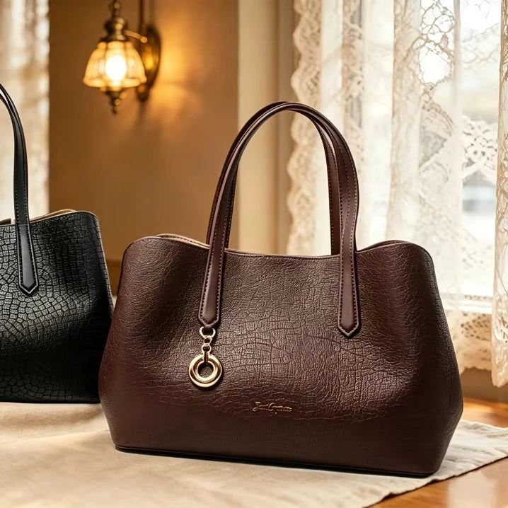 Dark brown vintage genuine leather designer handbag with alligator texture and gold circle charm. Business casual tote.