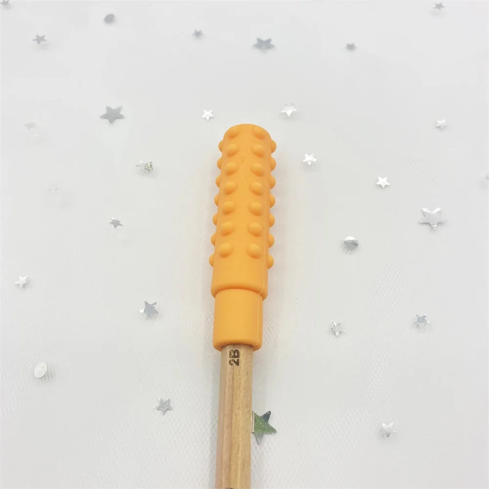 Orange silicone baby teething toy topper for pencil for soothing relief.