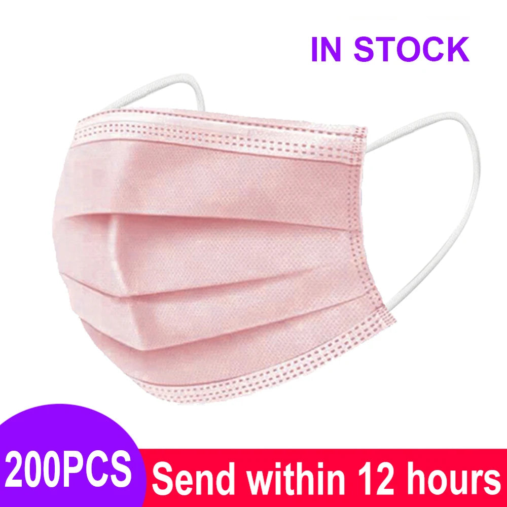 Pink 3-layer disposable non-woven meltblown mask with textured pleated surface and white elastic ear loops.