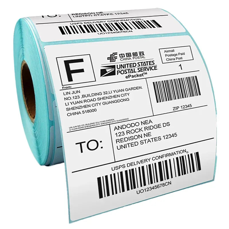 Close-up of shipping label sticker roll with barcode and teal border
