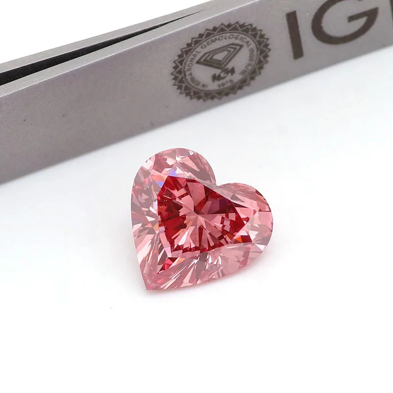 Pink heart-shaped lab-grown diamond, faceted loose stone on certificate card