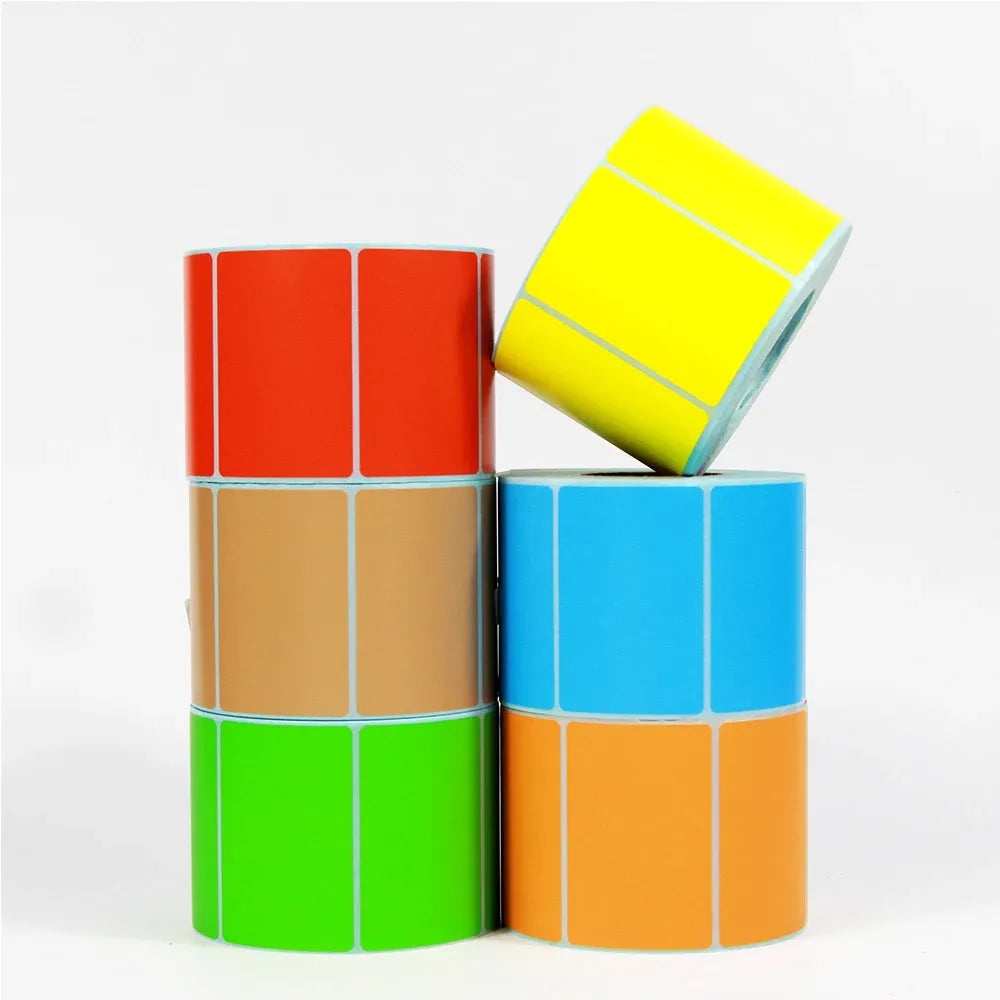Color label paper rolls, multiple bright colors stacked and grouped together.