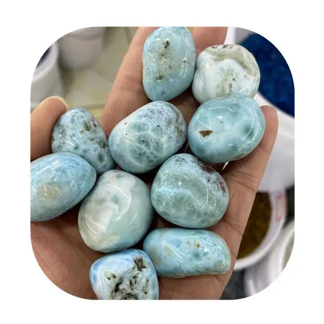 Handheld set of sky blue tumbled larimar stones, smooth rounded shapes