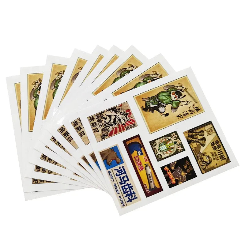 Stack of glossy waterproof vinyl sticker sheets with assorted cartoon label designs