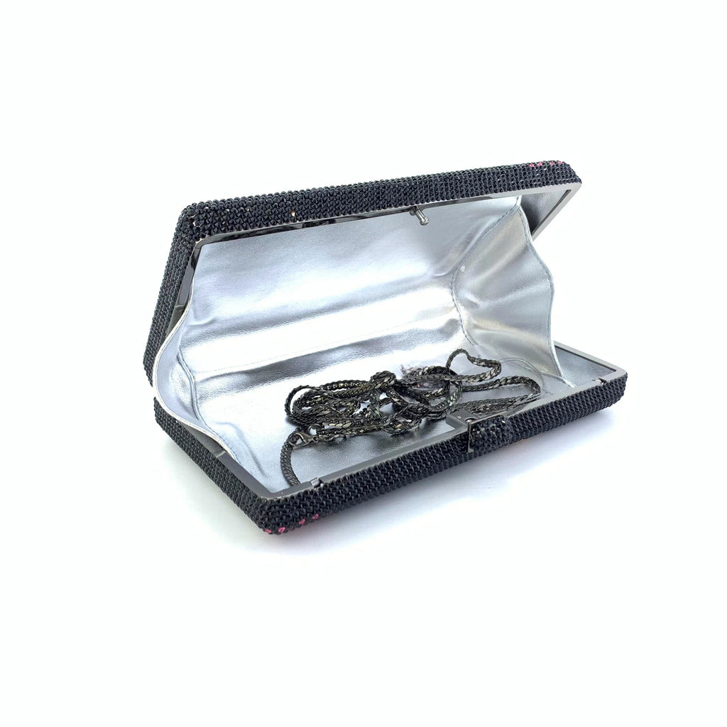 Black rhinestone Art Deco clutch purse with silver interior lining and detachable shoulder chain for evening wear.