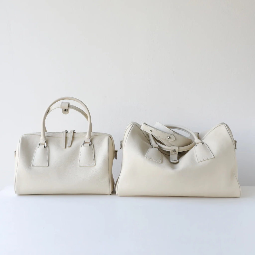 Cream vegetable-tanned leather minimalist tote and Boston handbags with double zip and large capacity design.