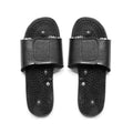 Black acupuncture reflexology massage slippers with adjustable straps and textured nodules for stress relief.