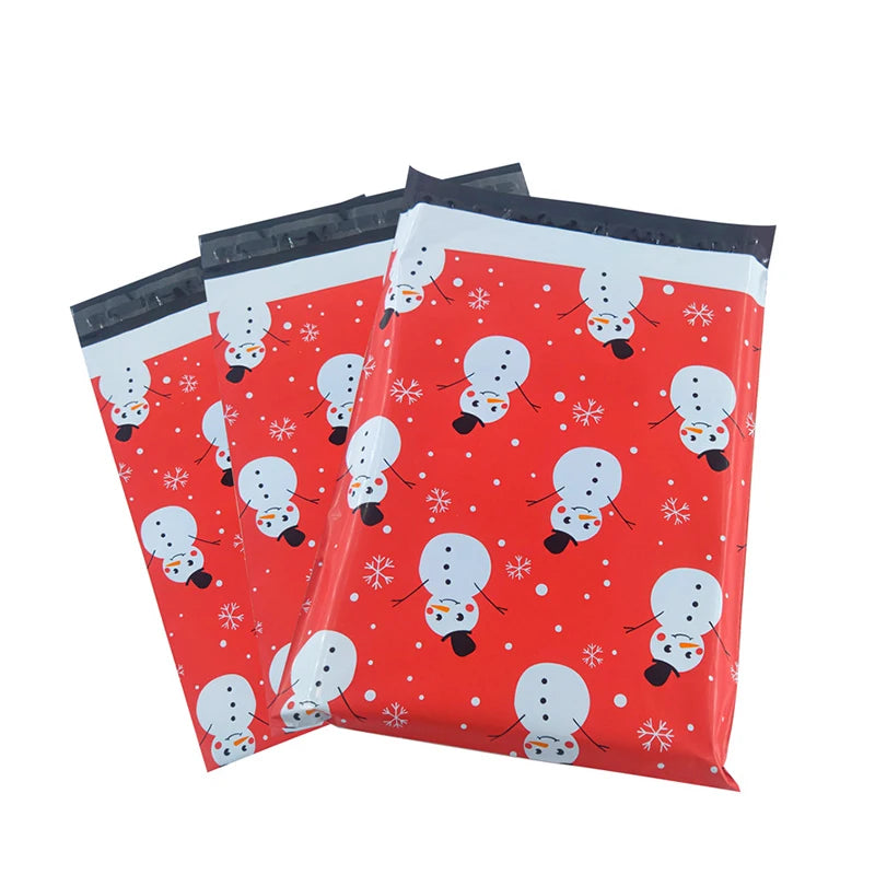 Stack of red waterproof poly mailers with snowman and snowflake print