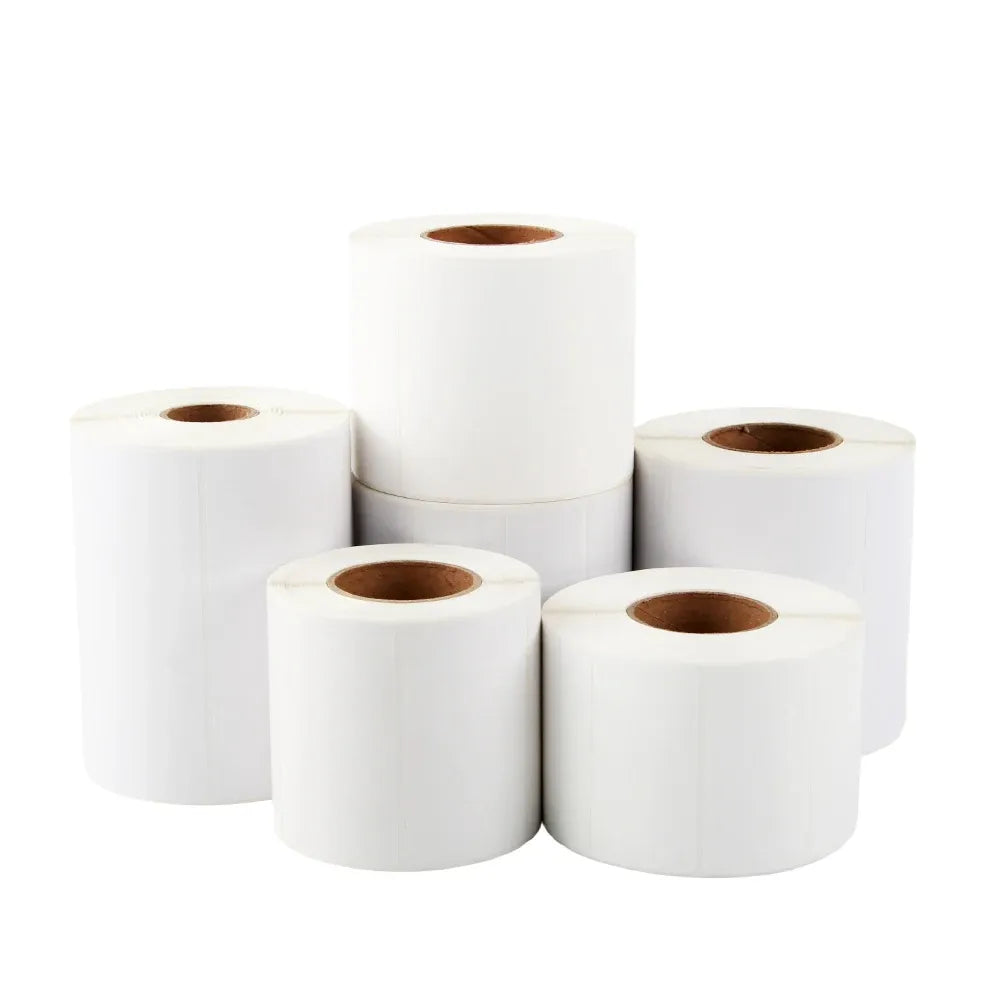 Set of white thermal label rolls with visible brown cores