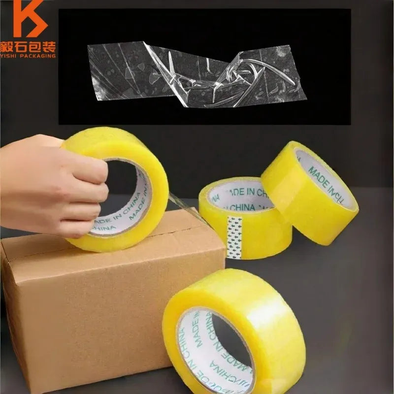 Yellow packing tape applied to a cardboard box, single-sided shipping tape roll