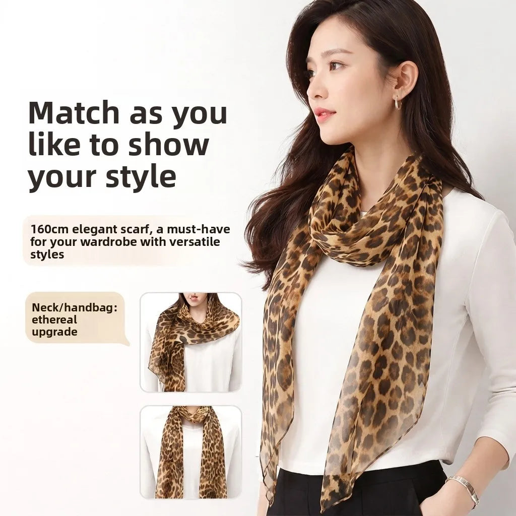Long 160cm rectangular luxury silk scarf with brown and black leopard print pattern worn by woman.
