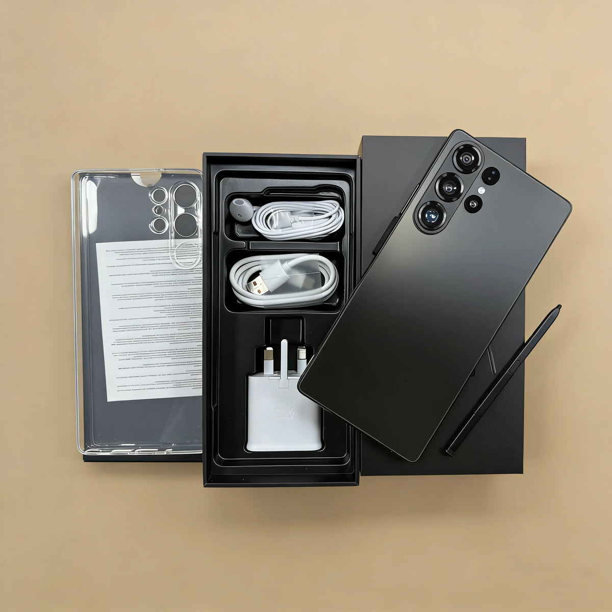 Smartphone with dark gray back, open box with charger, cables, and S Pen stylus