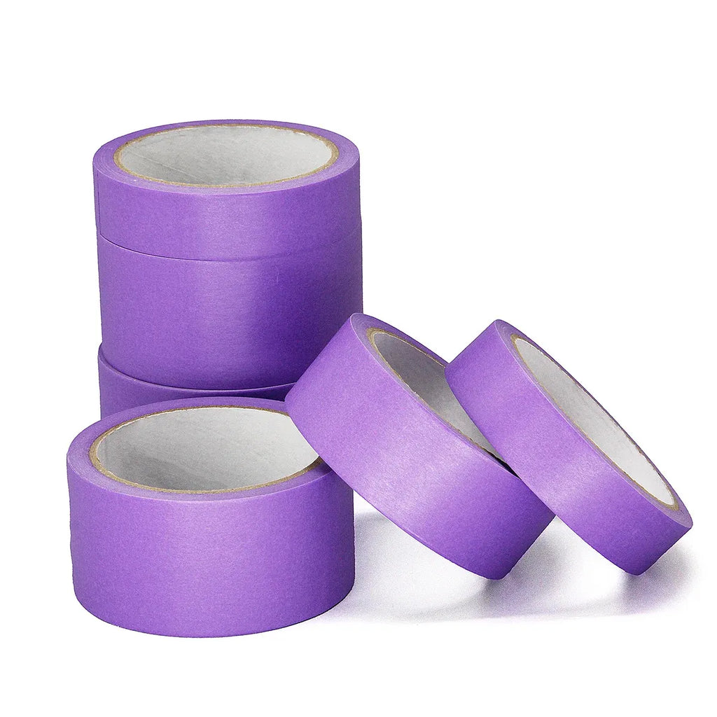Purple masking tape rolls set with two loose rolls and one standing roll.