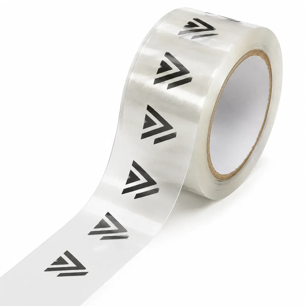 Printed adhesive shipping tape roll with repeating black chevron pattern on clear backing