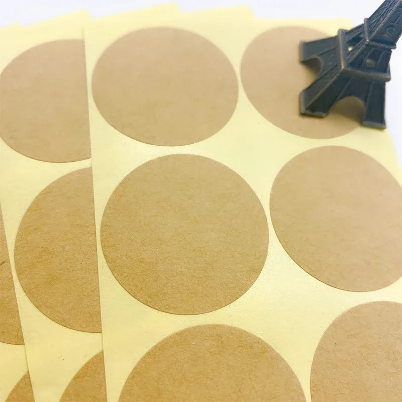Sheet of round kraft paper stickers with blank circles for sealing or labeling