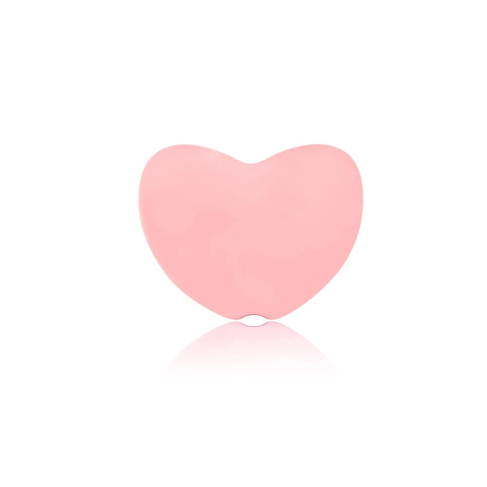 Pink heart-shaped silicone baby teething toy for soothing sore gums.