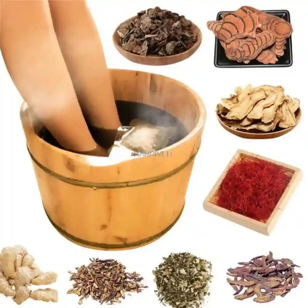 Feet soaking in a wooden bucket with herbal tea bags, ginger, safflower, and moxa for a Chinese medicine foot bath.