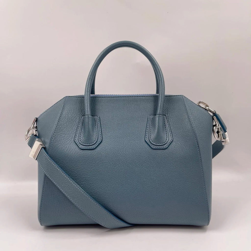 Luxury blue genuine leather designer tote crossbody bag with silver hardware and structured classic silhouette.