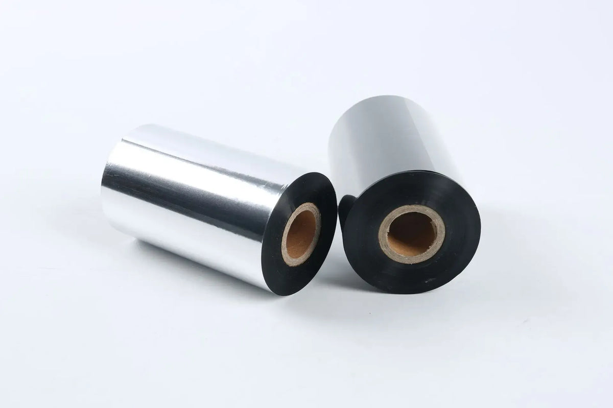 Clear BOPP tape rolls with black outer edges and cardboard cores