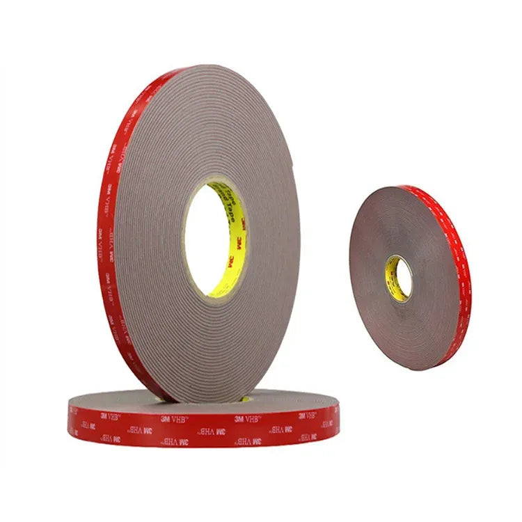 Gray double-sided acrylic foam tape roll with red adhesive band and small spare roll