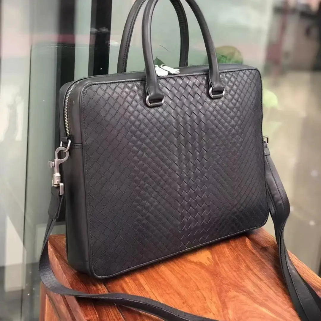 Black woven calfskin leather laptop briefcase for men with luxury slim design and silver hardware.