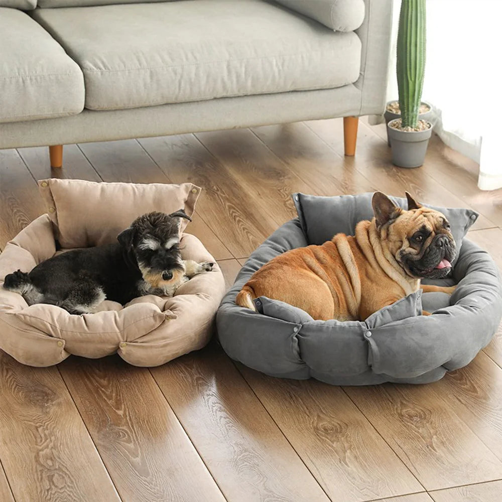 Two dogs relaxing in plush, warm, grey and beige sofa beds, perfect for cozy winter naps and pet comfort.