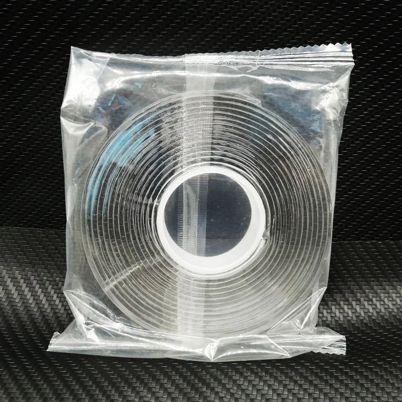 White double-sided nano tape roll in sealed plastic bag, circular coil centered