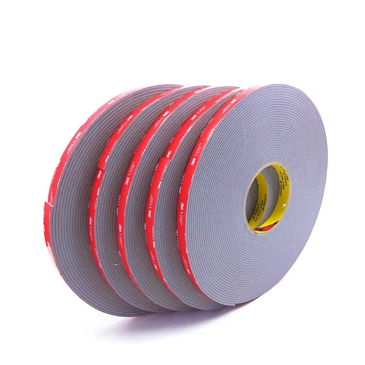 Stack of double-sided acrylic foam tape rolls, gray tape with red adhesive bands
