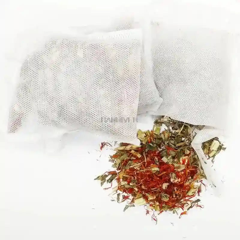 Chinese herbal foot bath tea bags with visible ginger, safflower, and mugwort for home spa soaking therapy.
