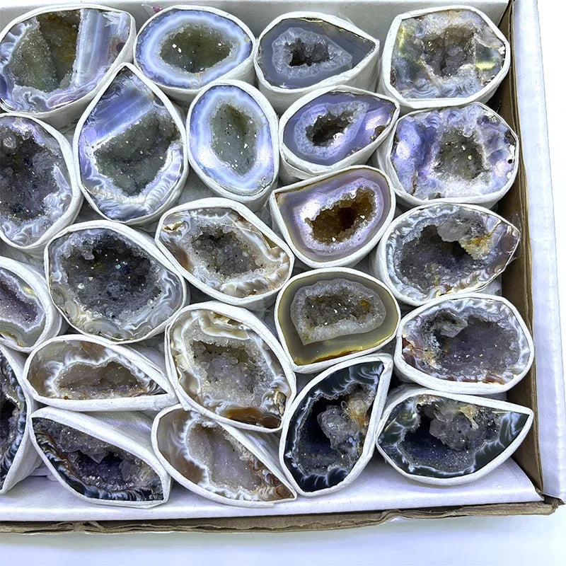 Agate geode crystal slices in a gift box, round and heart-shaped dark stone pieces