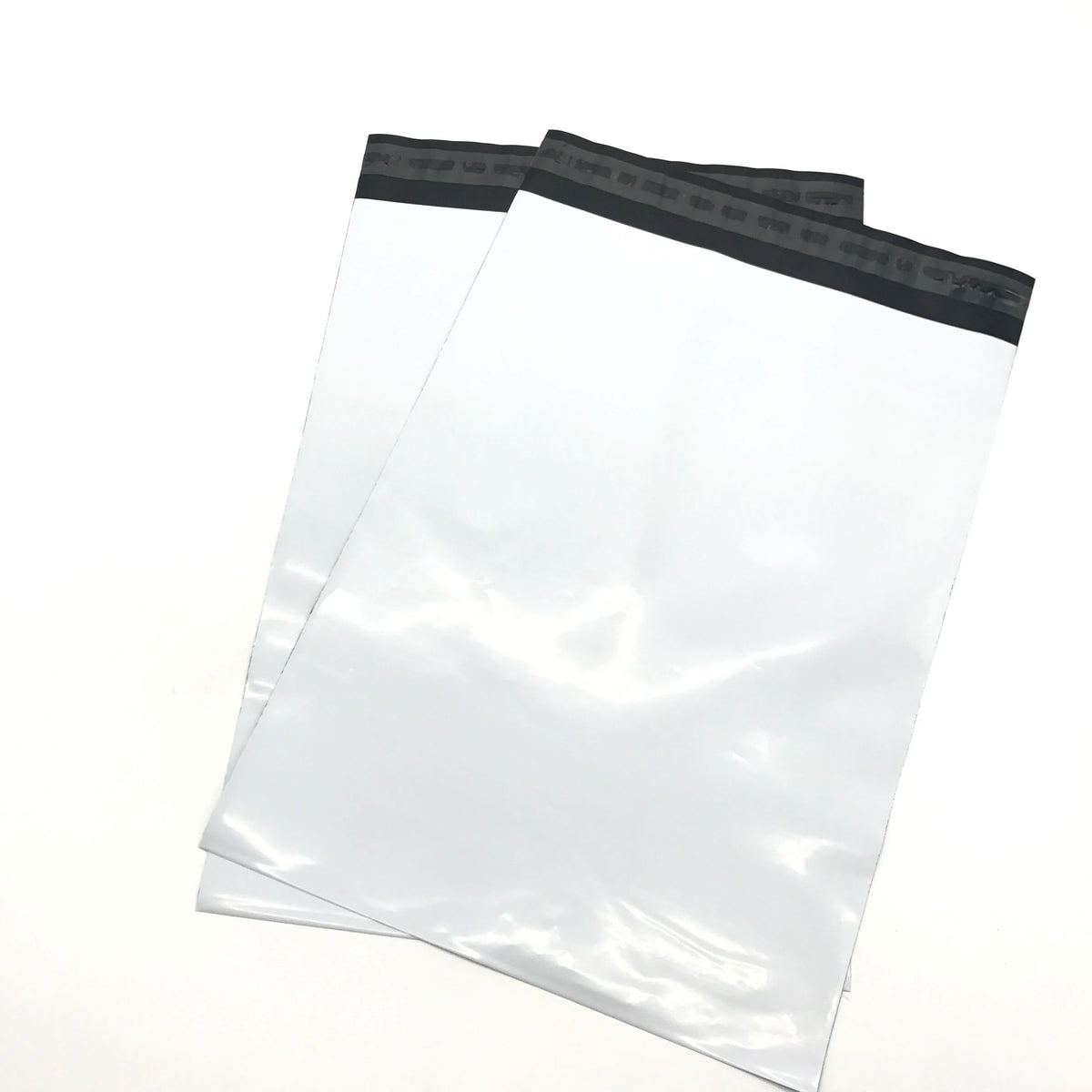 White plastic mailer bags with black top strip and glossy sealed surface.