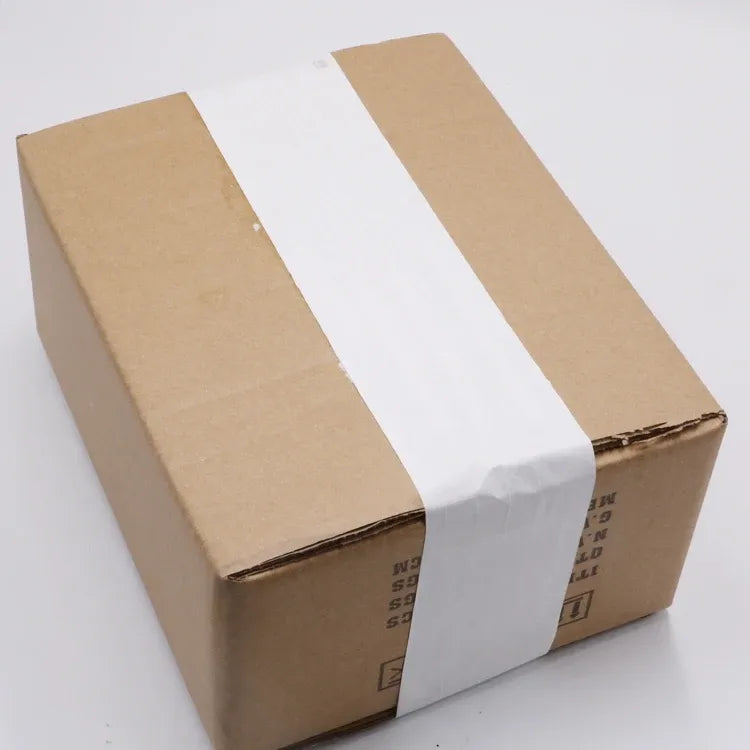 White kraft paper tape sealing two cardboard box tops for shipping