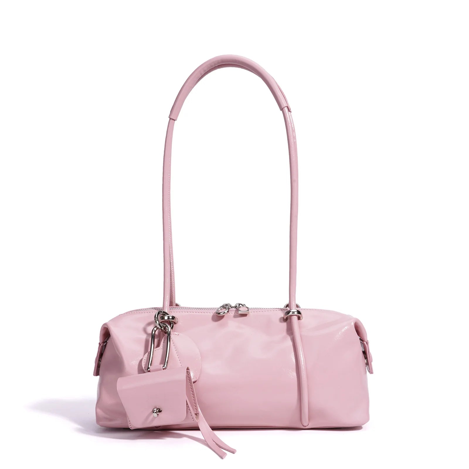 Light pink minimalist Boston underarm shoulder bag in smooth luxe material with silver hardware and a small coin charm.