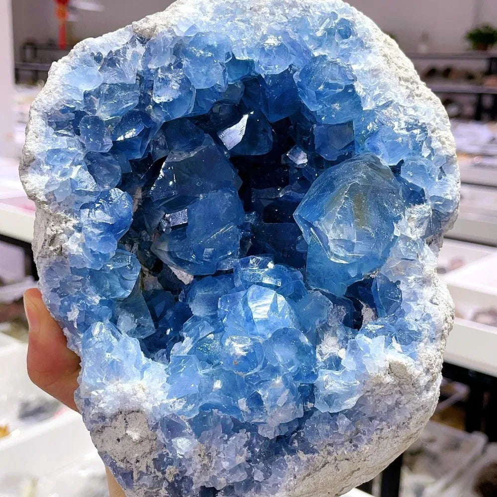 Blue celestite geode cluster with translucent crystal faces