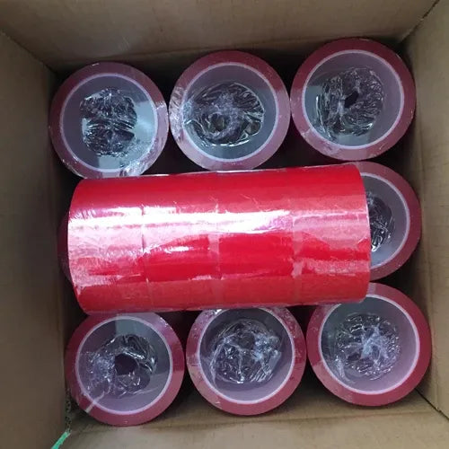 Red security seal void tape rolls in a cardboard box, showing tamper-evident VOID text