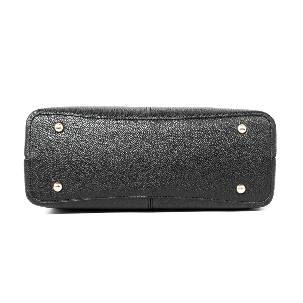 Bottom view of black pebbled PU leather designer handbag with four protective gold-tone metal studs.