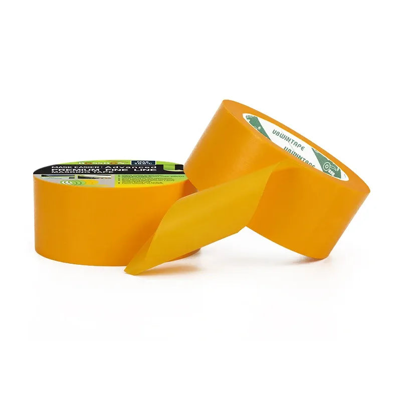 Yellow masking tape jumbo rolls with loose tape ends for painting and masking