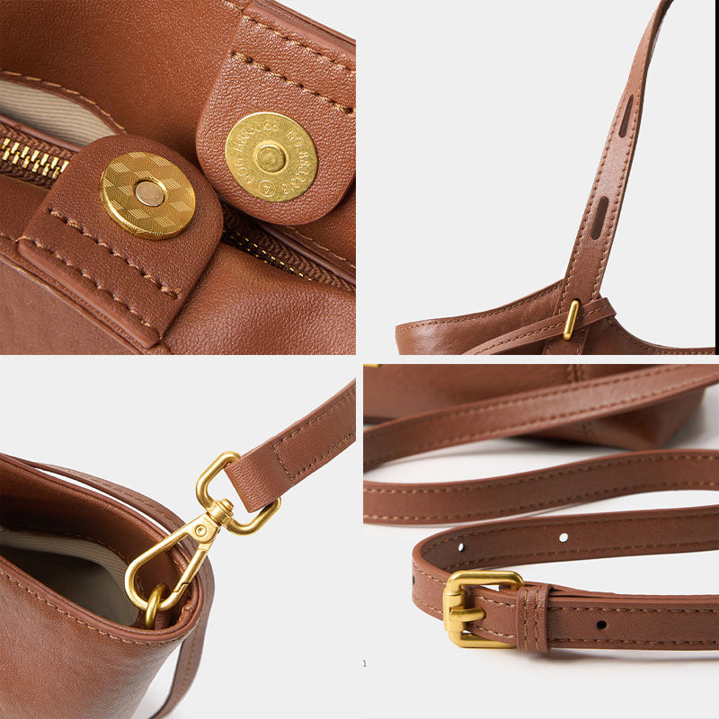 Brown genuine top-grain leather designer armpit bag with gold hardware, adjustable strap, and magnetic snap closure.