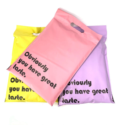 Assorted mailing bags in pink and lavender with side handle cutout