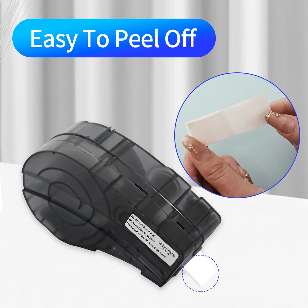 Black label printer cartridge with white backing tape being peeled by hand