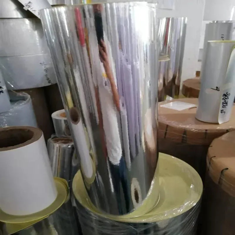 Roll of glossy silver self-adhesive PET label sheet material