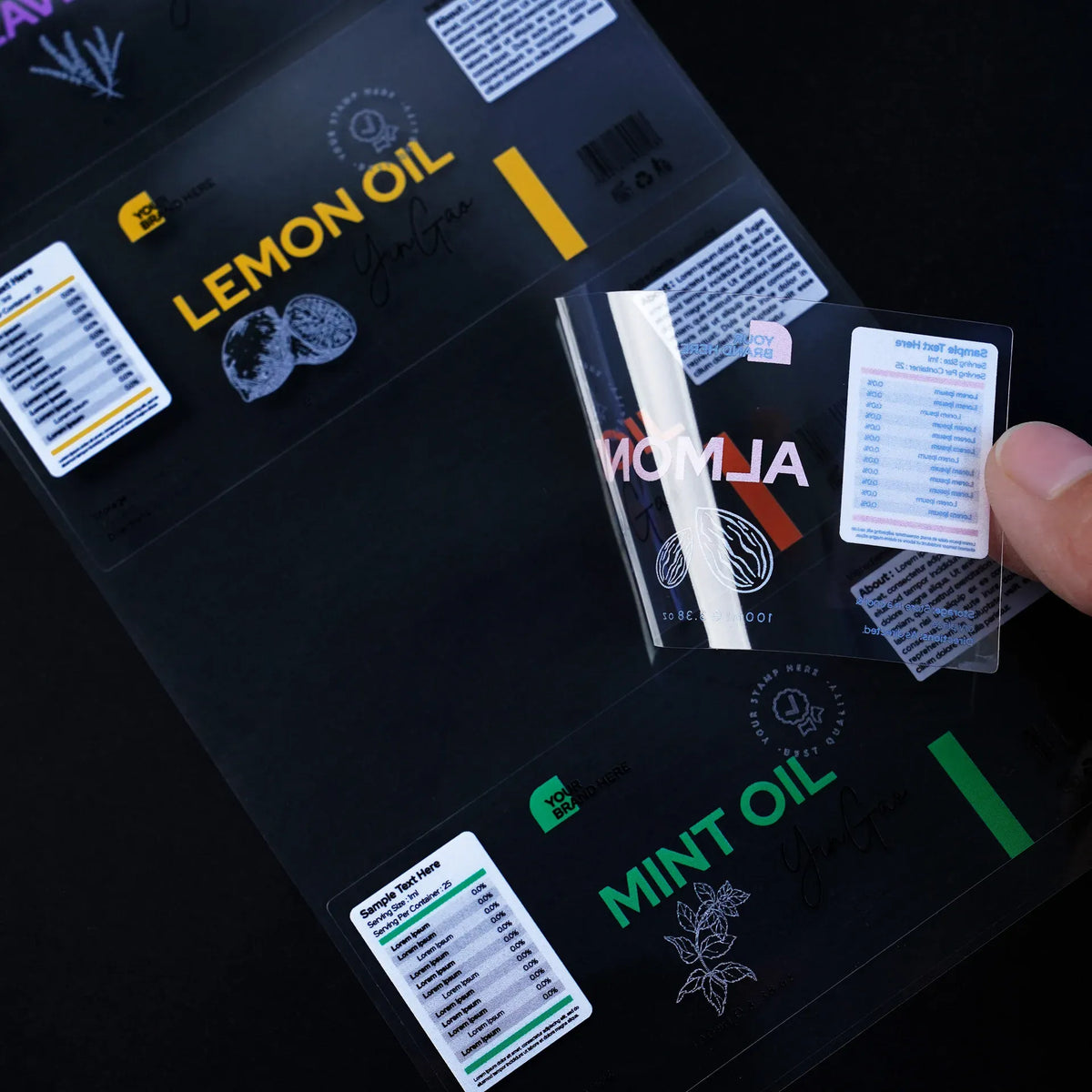 Clear film label stickers with colorful text and small barcode-style blocks