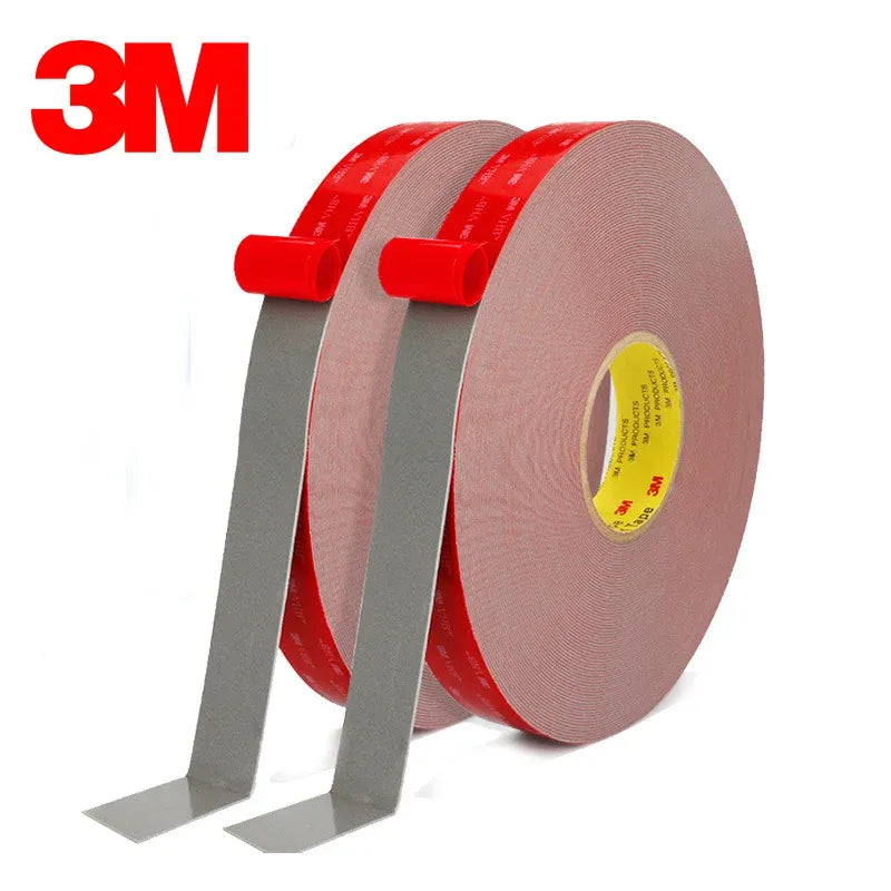 Gray double-sided foam tape roll with two red-backed strips