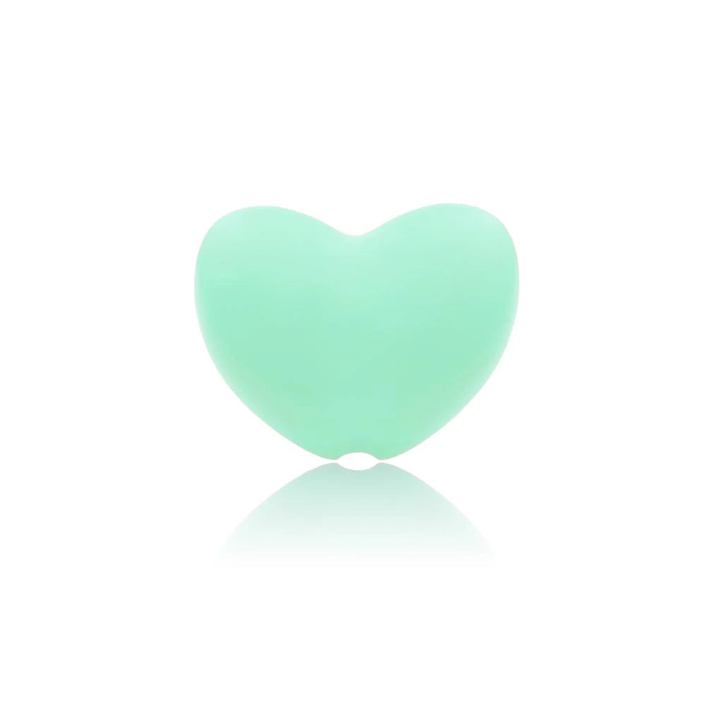 Mint green heart-shaped silicone teething toy for baby teething relief.